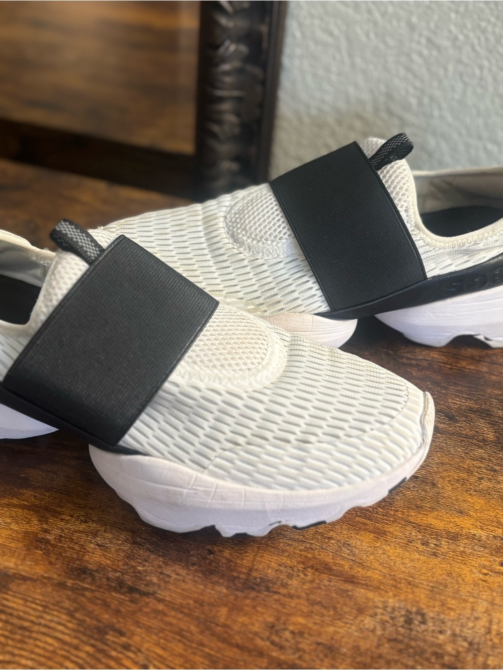 Sorel Kinetic Impact Strap sneakers in white with a black strap